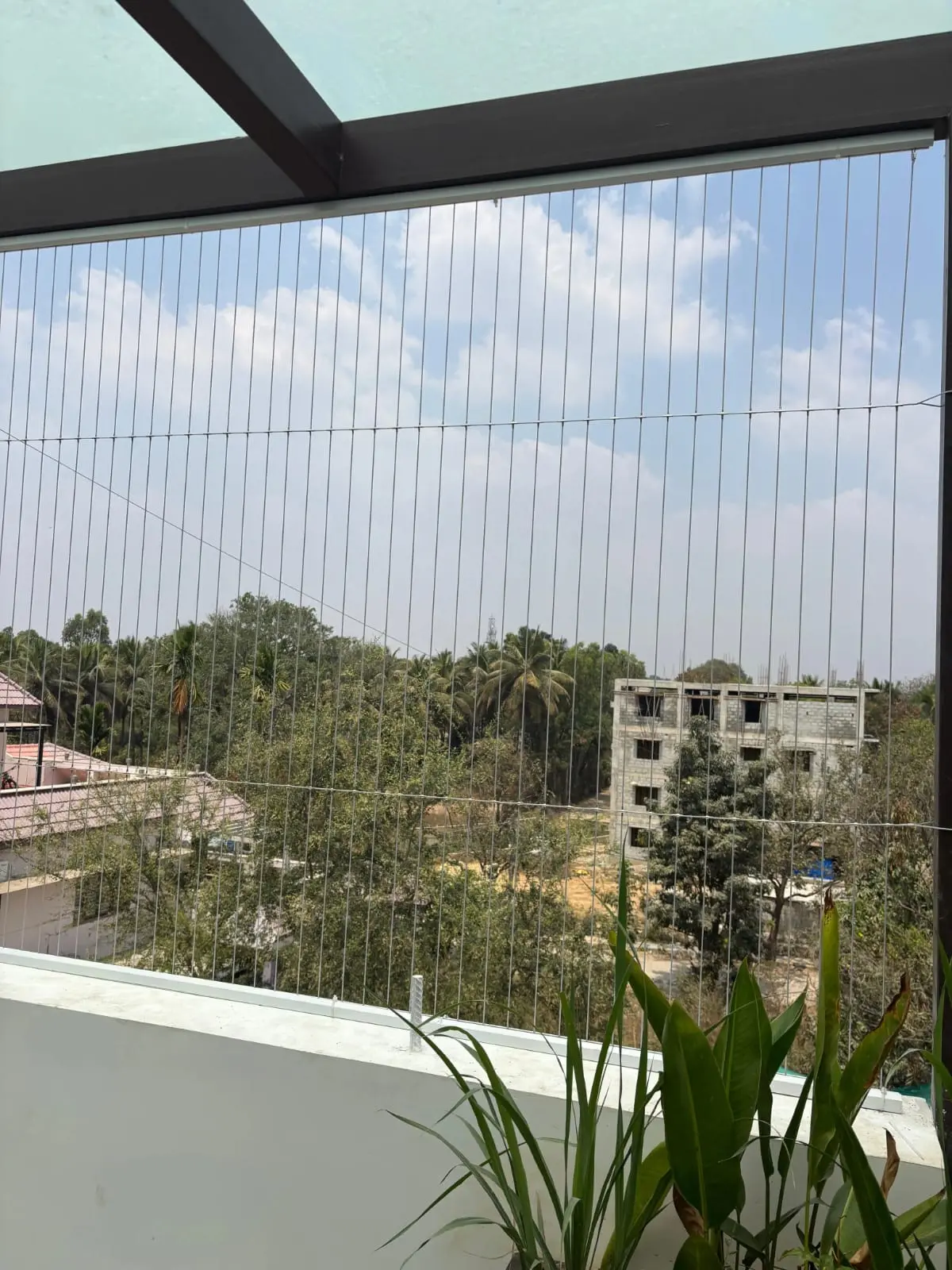 Marine-grade SS316 invisible grill system on Bangalore apartment window