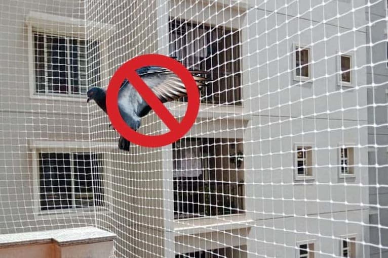 Durable pigeon exclusion netting on residential apartment balcony